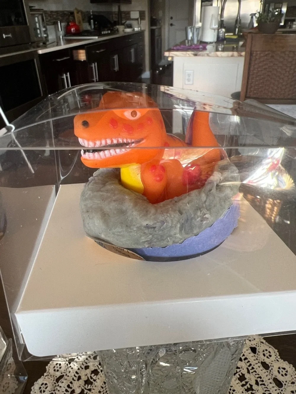 Hand Crafted Orange Dinosaur Bath Toy in Gray Nest